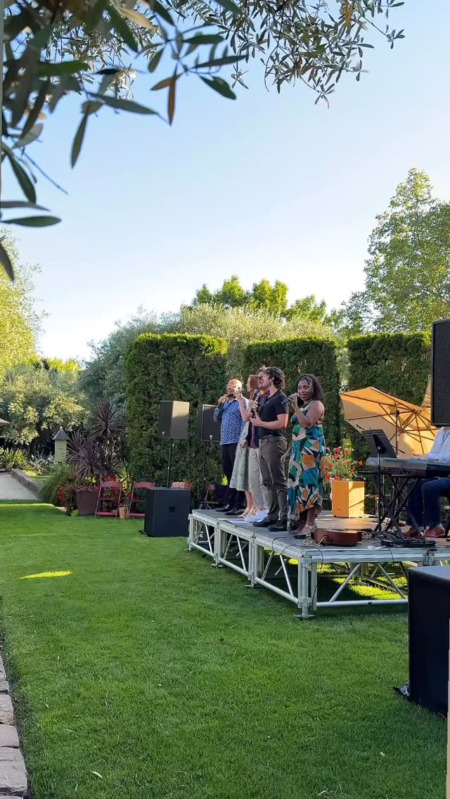 Performers on an outdoor stage at a Sonoma wine-country event