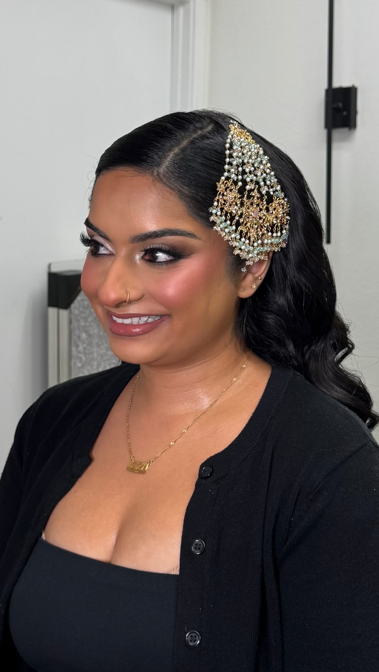 Client wearing defined eye makeup and a glowing complexion