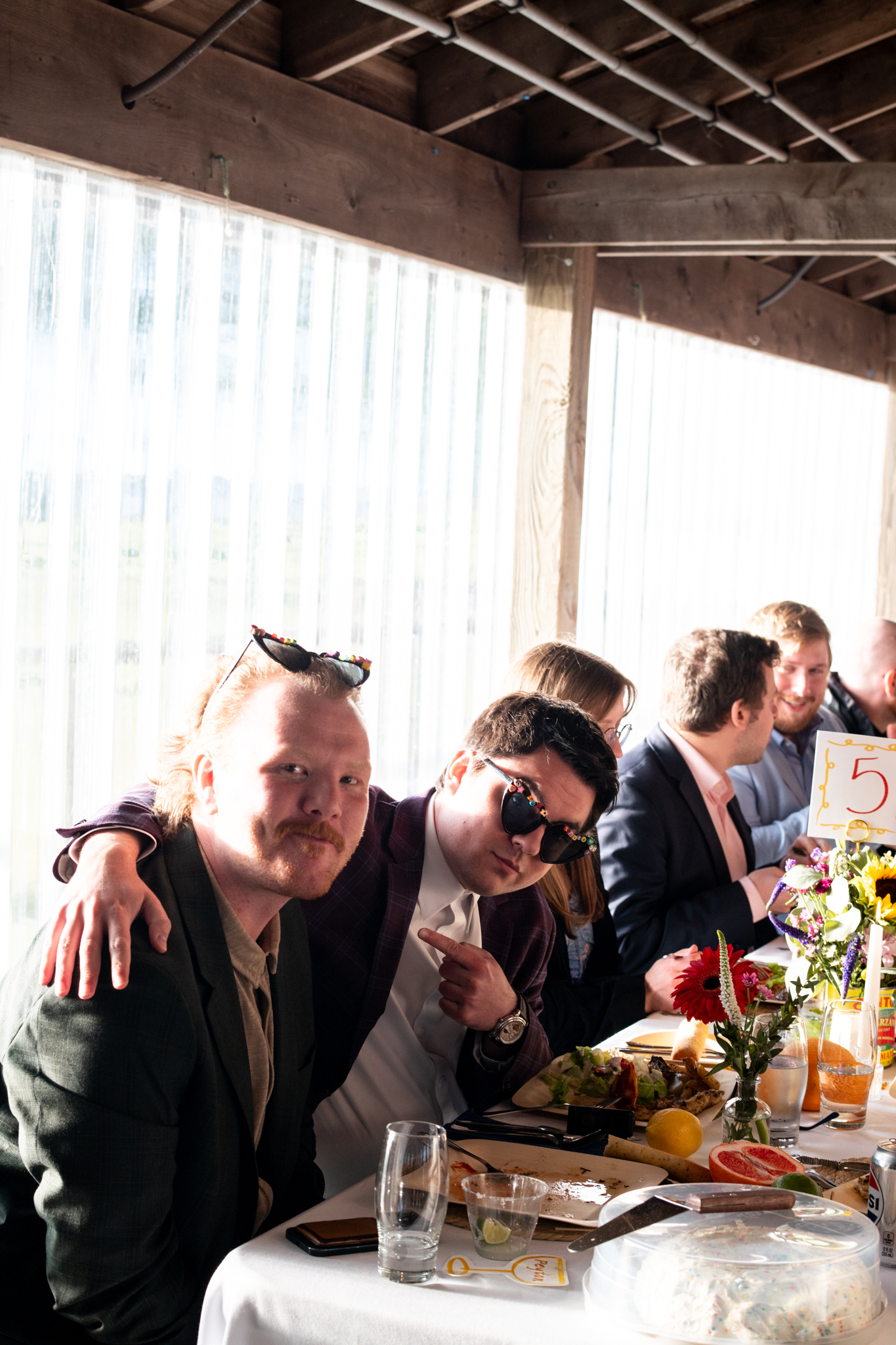 Guests sharing a playful candid moment at a celebration