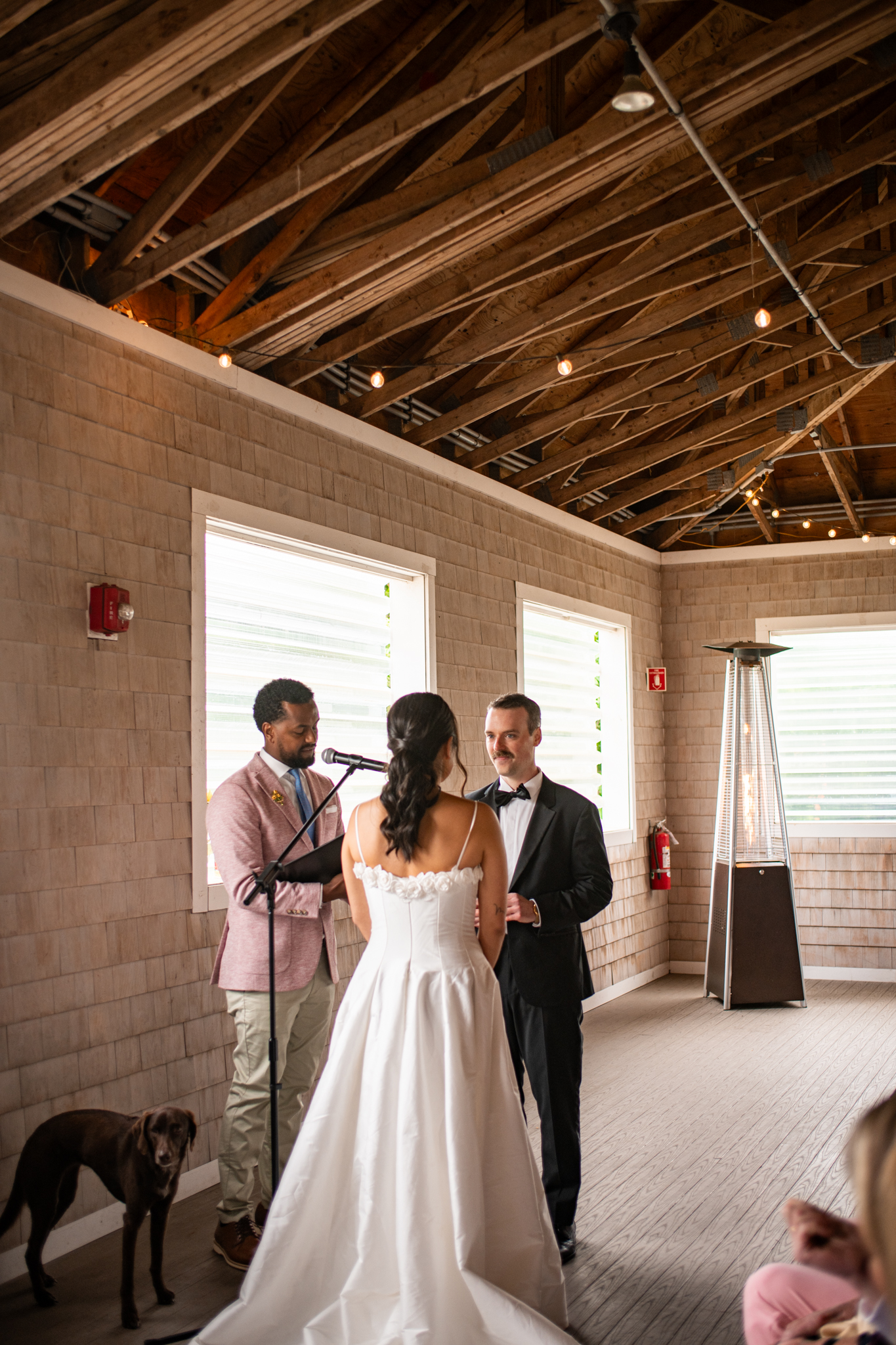 Wedding ceremony in a warm wood-lined venue